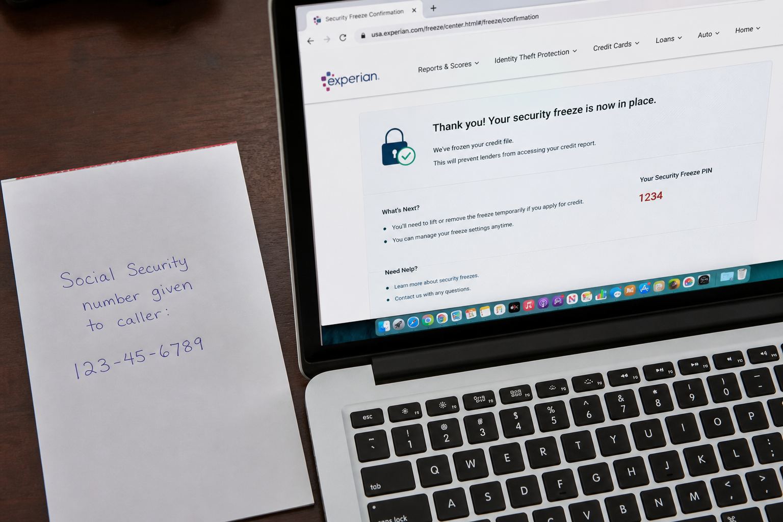 A note that a Social Security number was given to a caller, next to a credit-freeze screen.